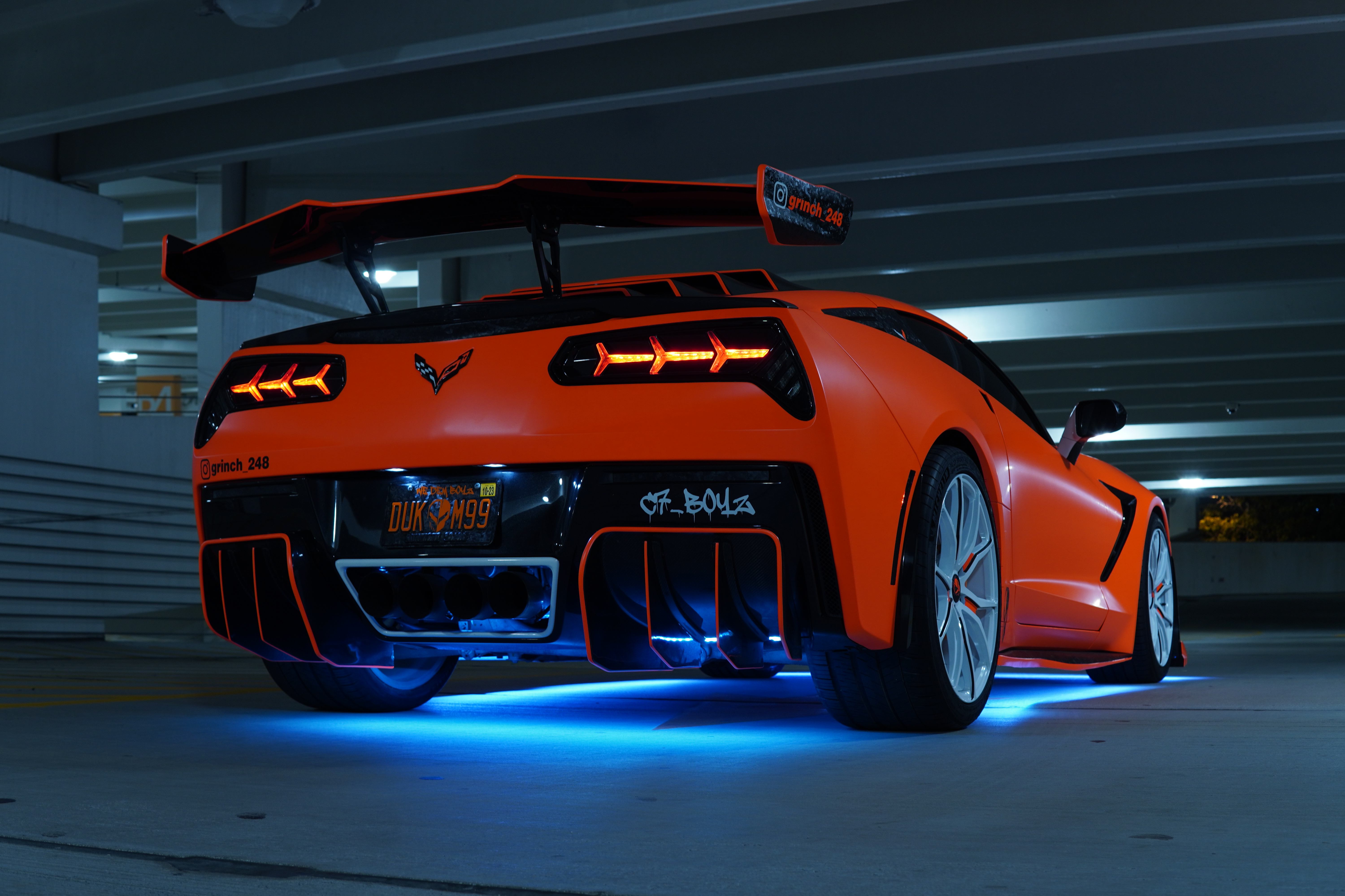 Orange Corvette C7 with underglow